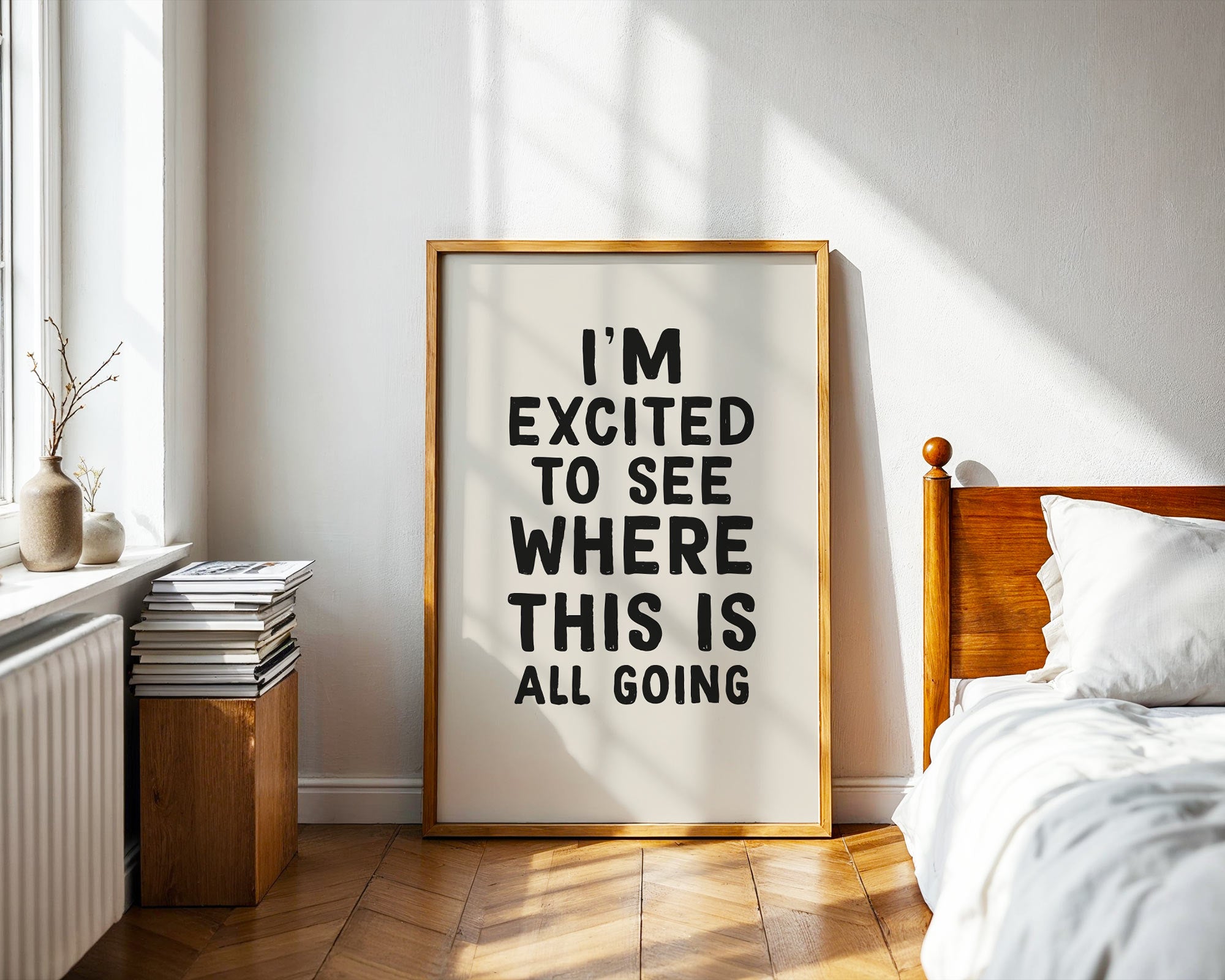 Framed motivational home print in a bedroom
