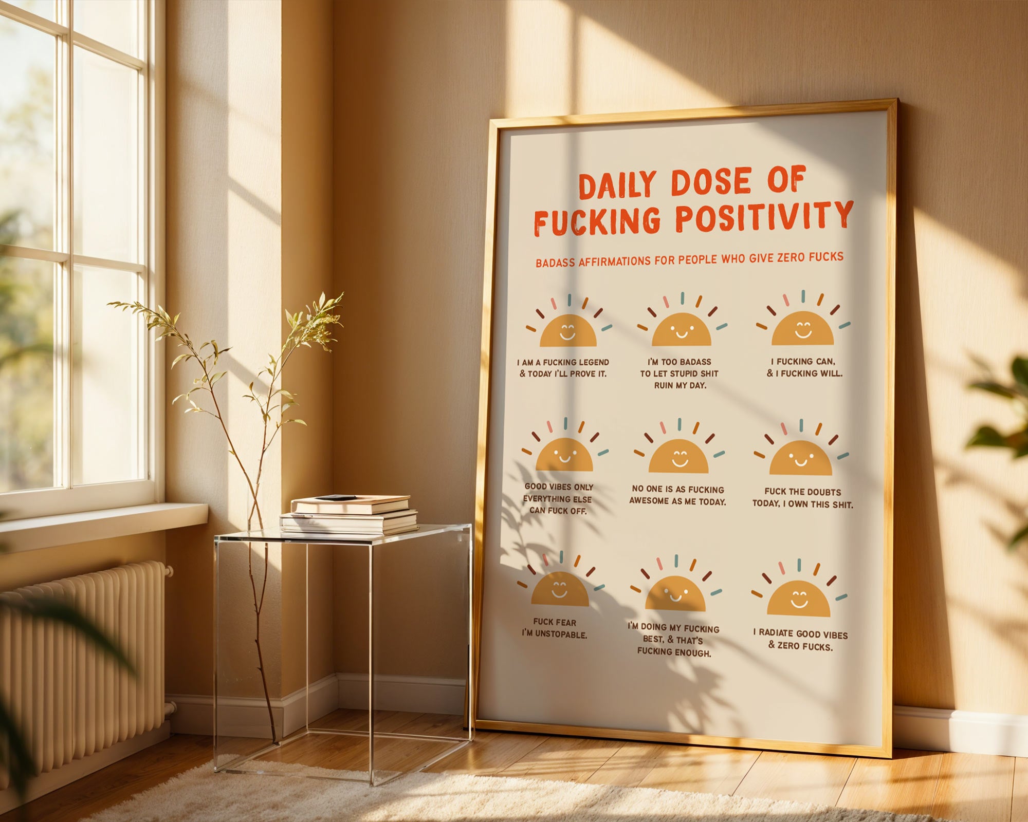 Framed poster titled 'Daily Dose of Fucking Positivity' in a sunlit room.