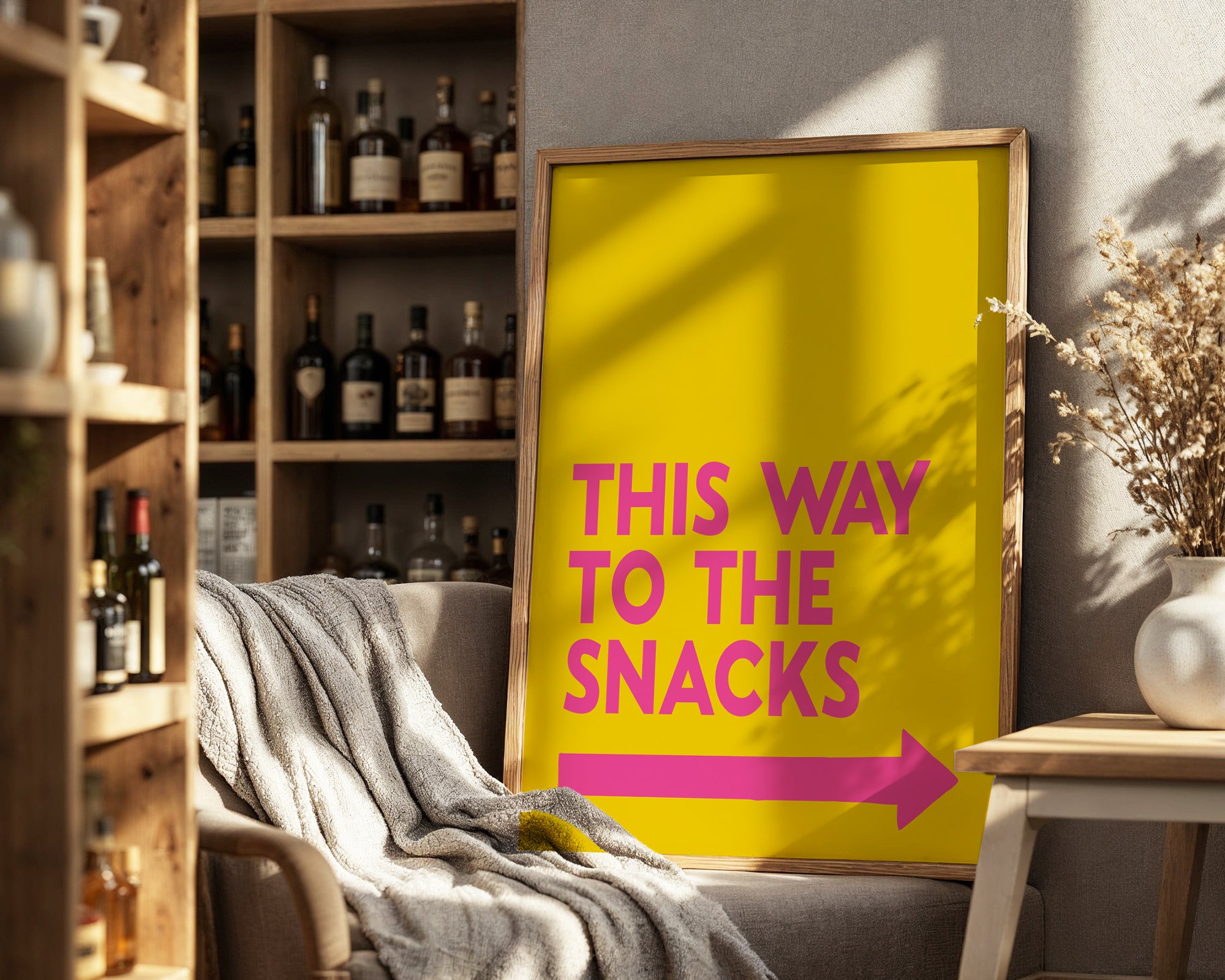 Yellow sign with pink text and arrow in a room with shelves and decor