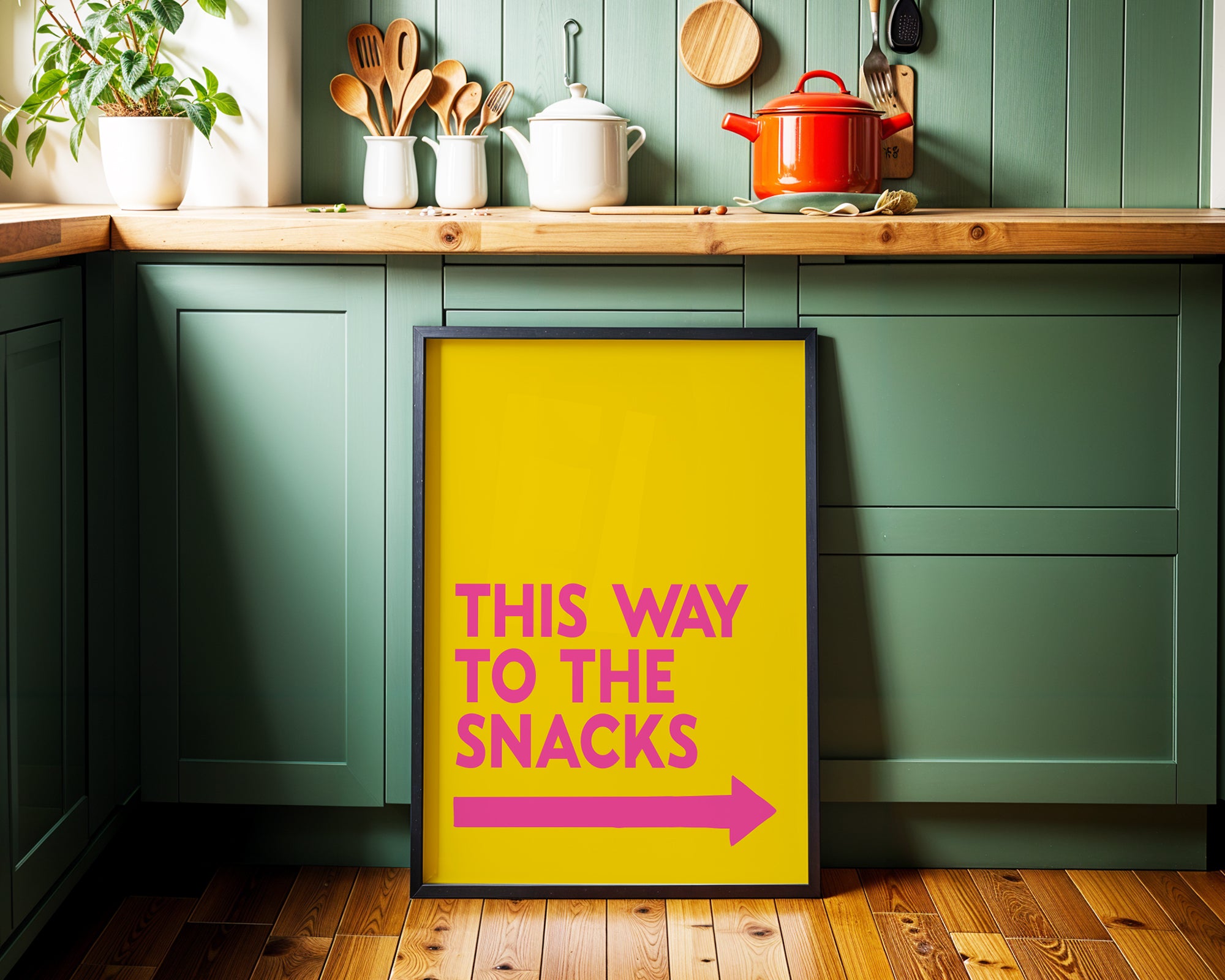 Yellow sign with pink text and arrow in a kitchen setting
