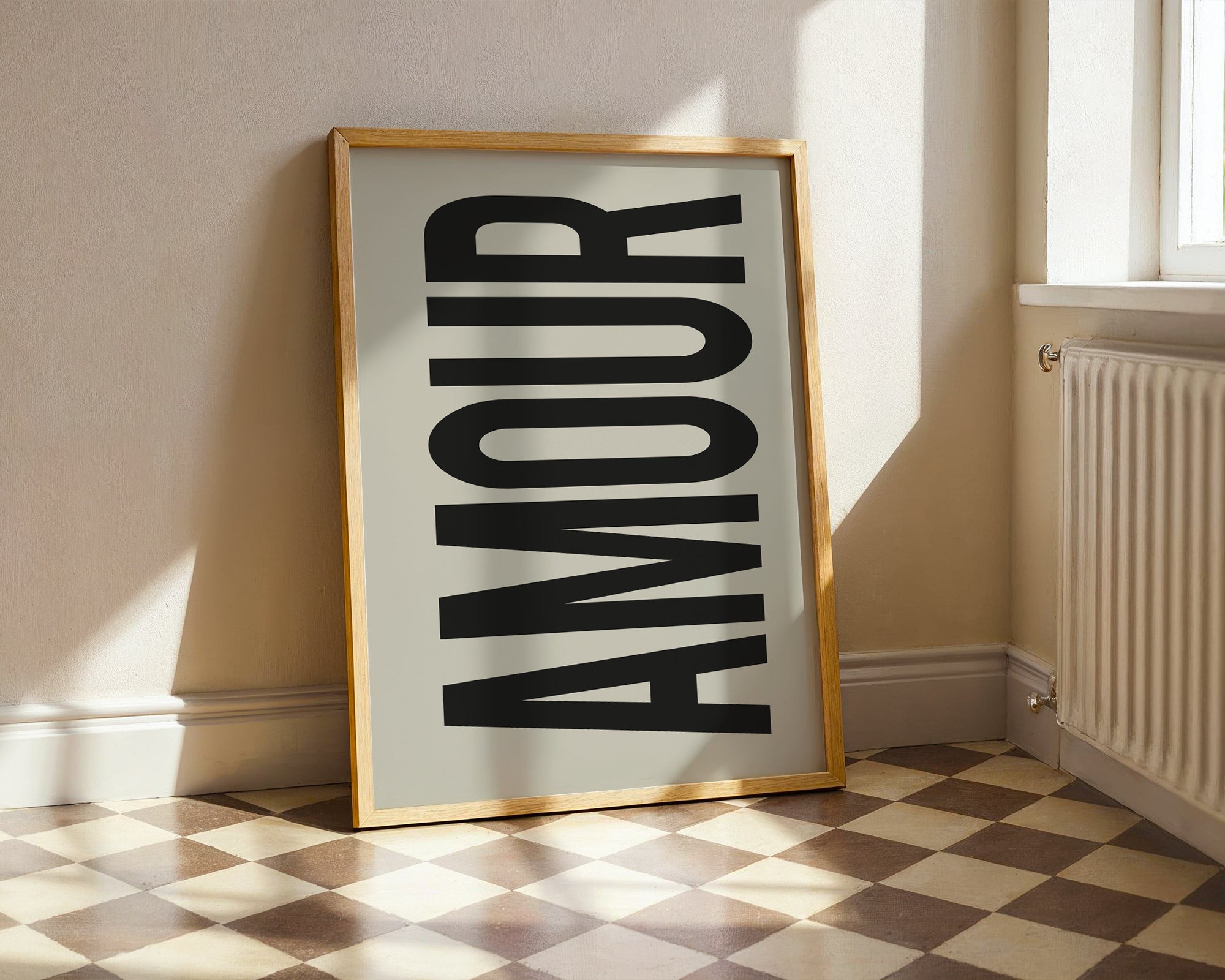 Framed artwork with the word 'AMOUR' on a checkered floor.