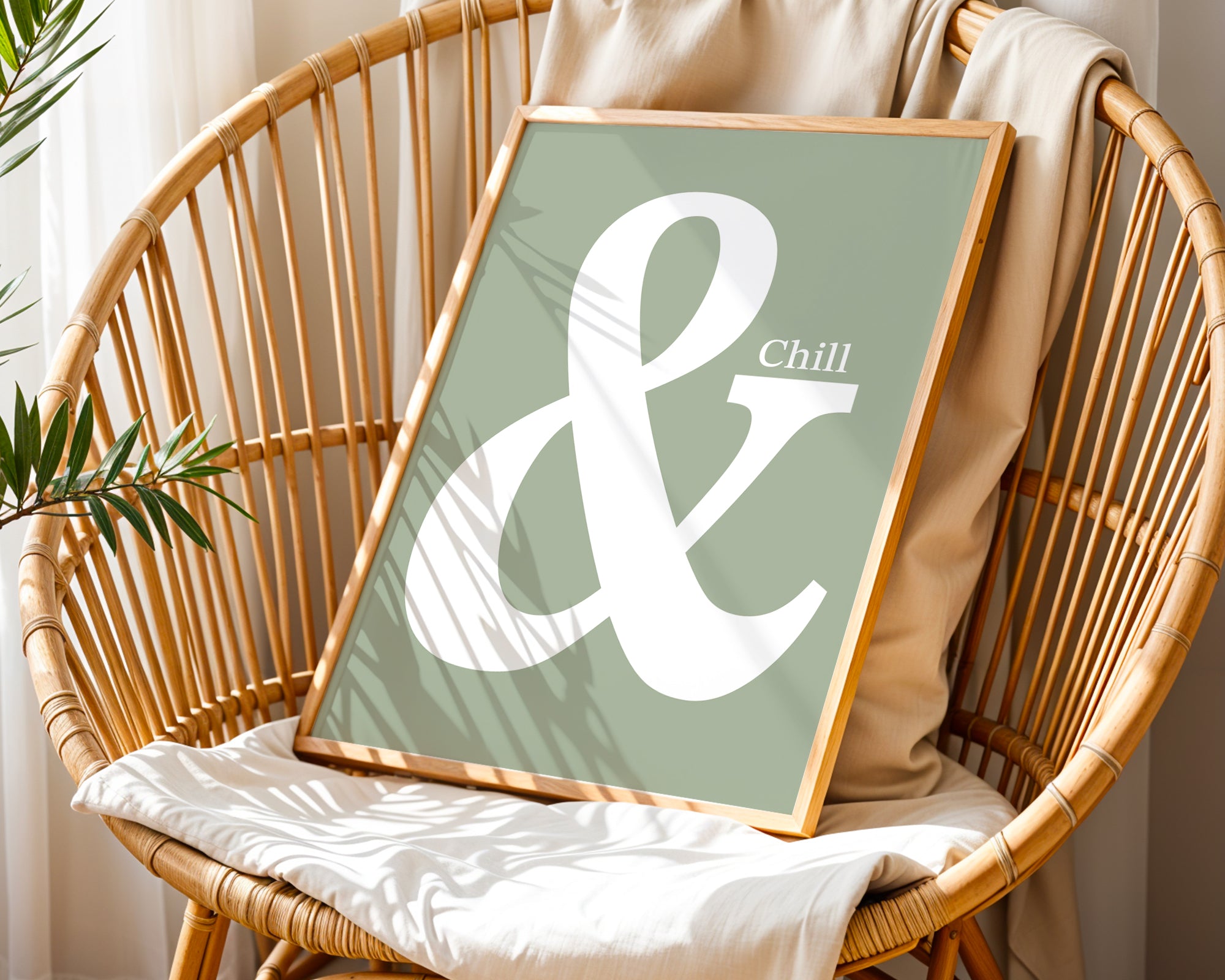 Framed artwork with 'Chill &' design on a wicker chair