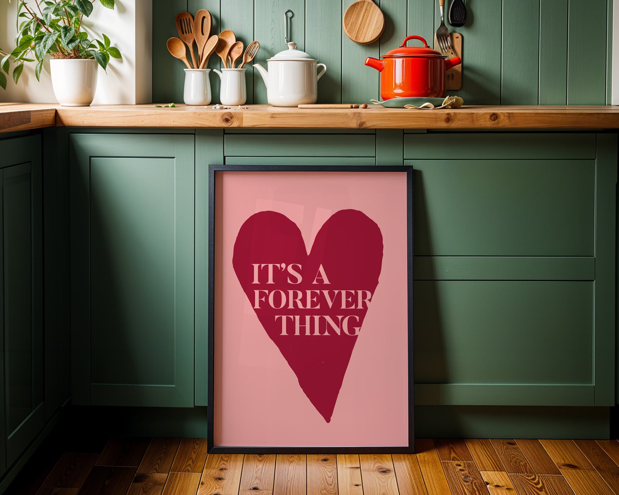 Framed poster with heart design and text in a kitchen setting