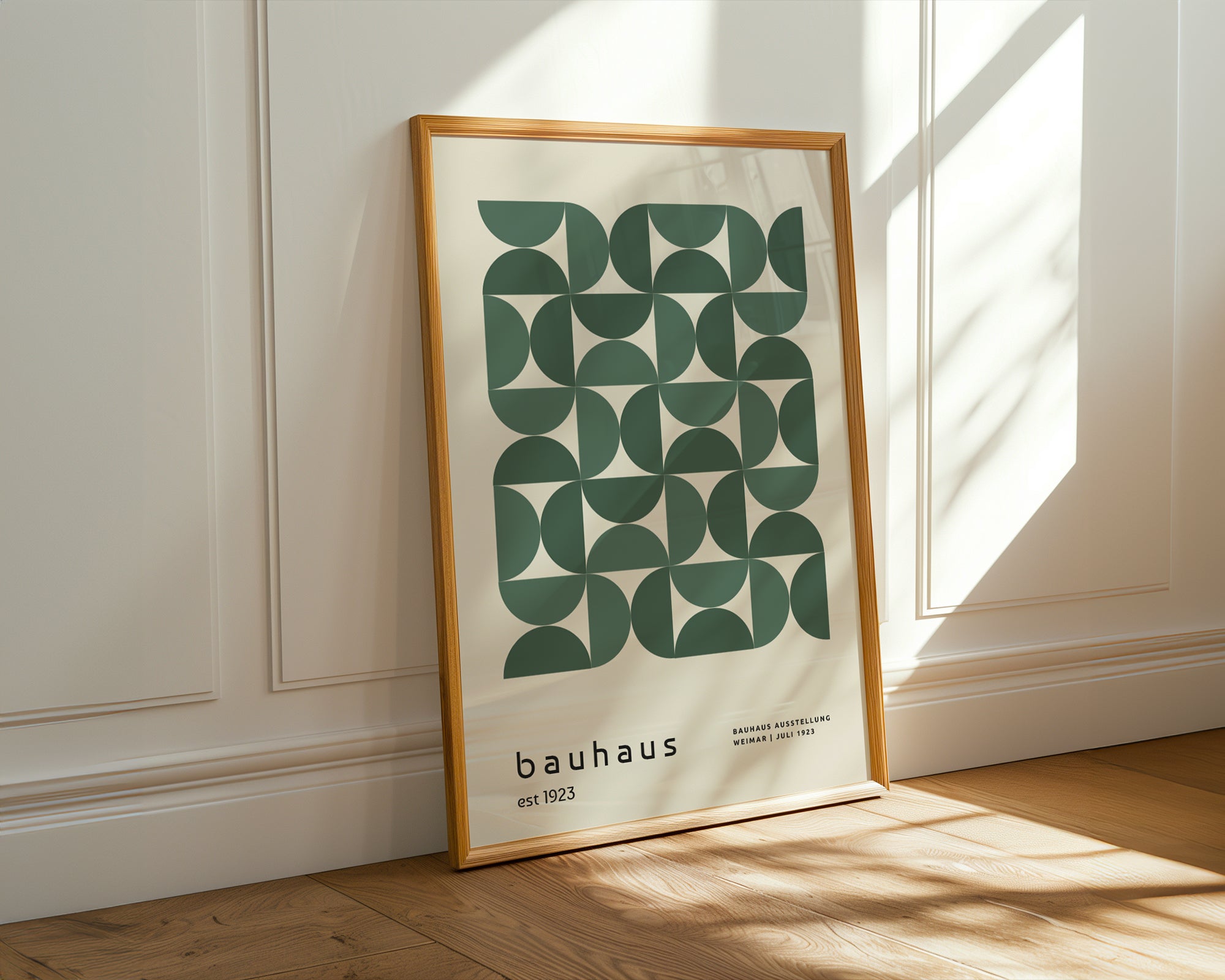 Framed Bauhaus poster on a wall with sunlight casting shadows