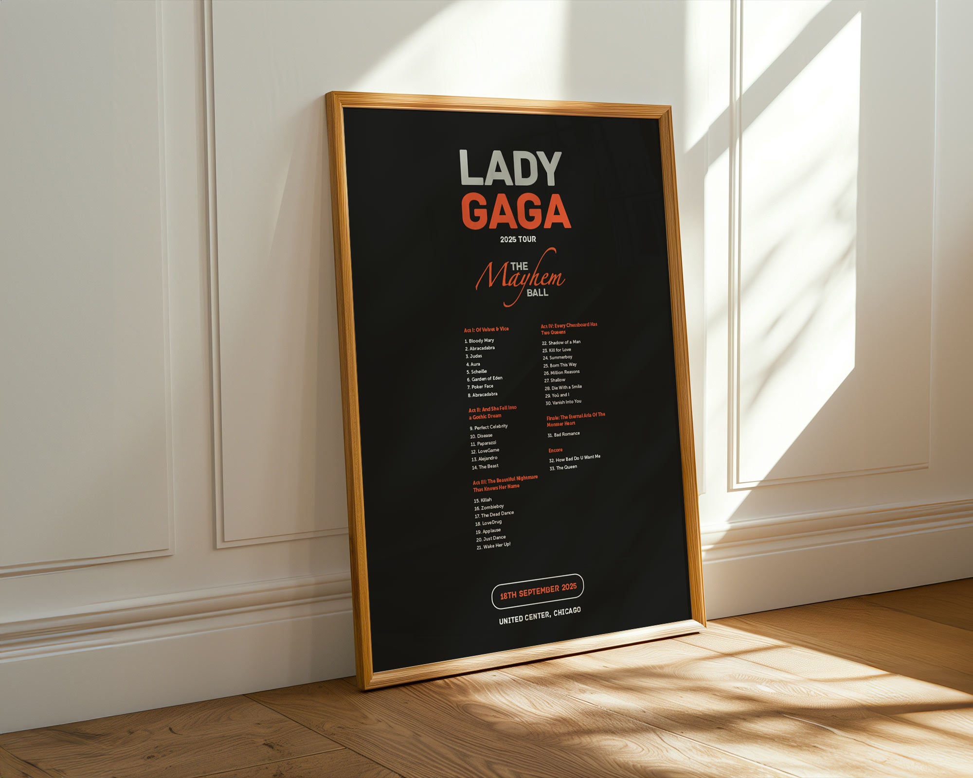 Framed poster of Lady Gaga's 'The Monster Ball' tour on a wall.