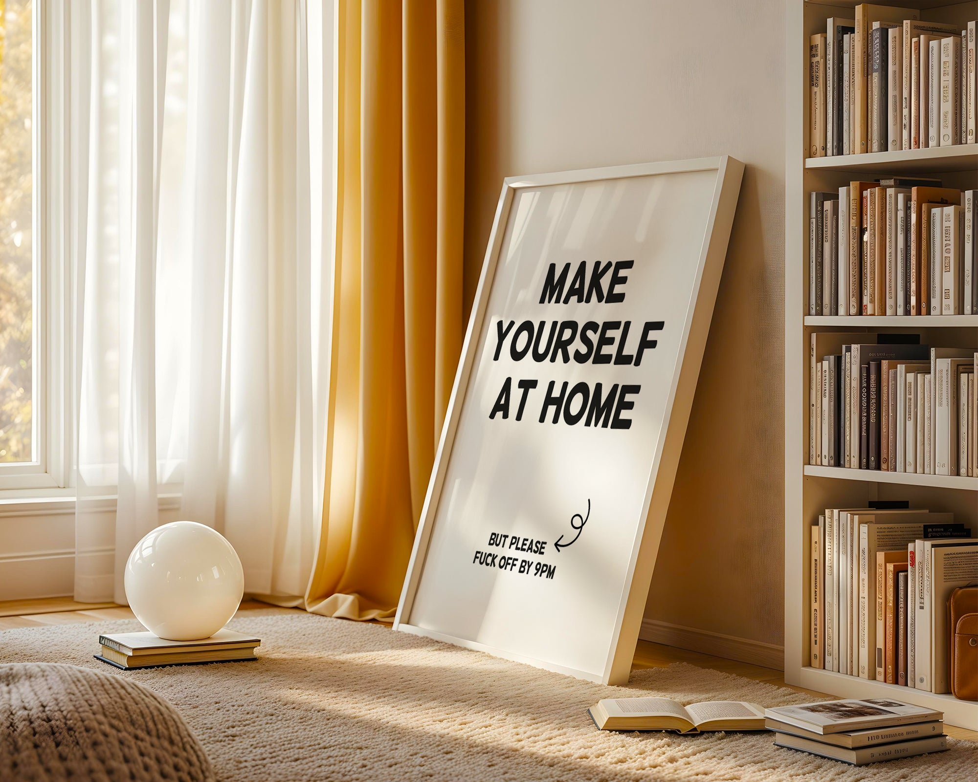 Framed artwork with text in a cozy room with books and decor.