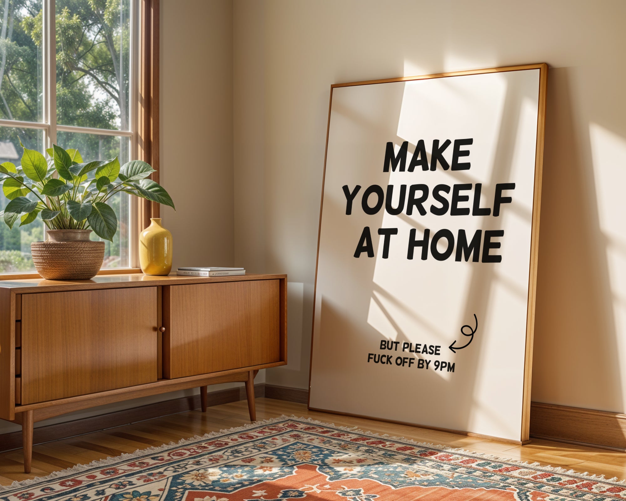 Room interior with a wooden sideboard, plant, and large framed poster with text.