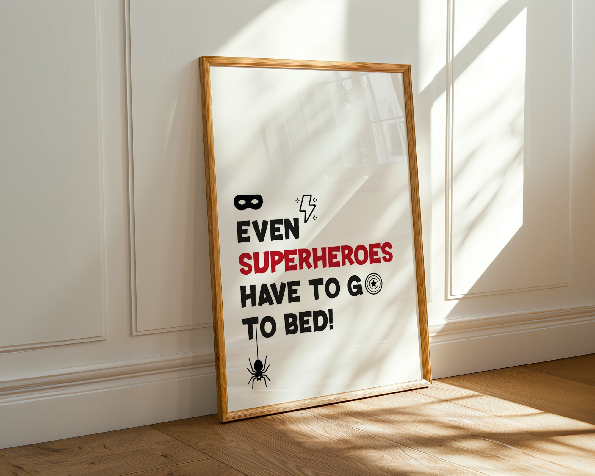Framed poster with humorous superhero quote on a wall.